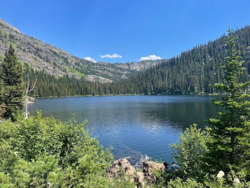 Upper Holland Lake at midday in a cirque basin of the Swan Range, Montana